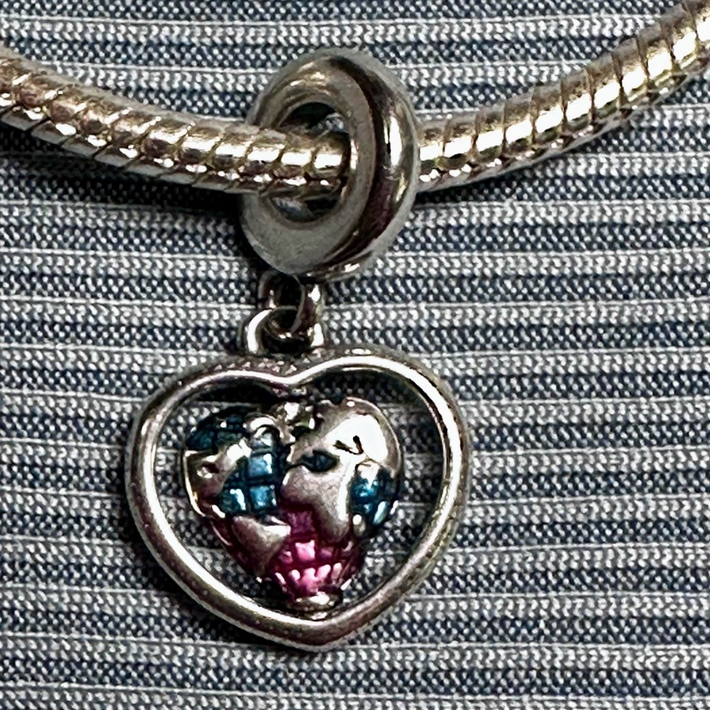 .925 silver rotating heart globe charm